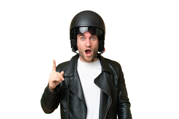 Young caucasian man with a motorcycle helmet isolated on green chroma background intending to realizes the solution while lifting a finger up