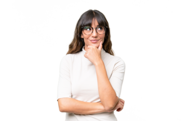 Young caucasian woman over isolated background thinking an idea while looking up