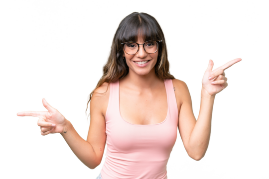 Young caucasian woman over isolated background pointing finger to the laterals and happy
