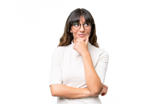 Young caucasian woman over isolated background thinking an idea while looking up - Powered by Adobe