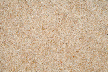 Fototapeta premium Cardboard surface close-up, craft beige paper structure, macro, rough background of recycled waste paper