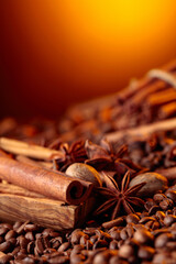 Obraz na płótnie Canvas Roasted coffee beans with cinnamon sticks, anise, and nutmeg.