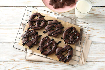 Concept of tasty bakery, gingerbread cookies in chocolate, top view