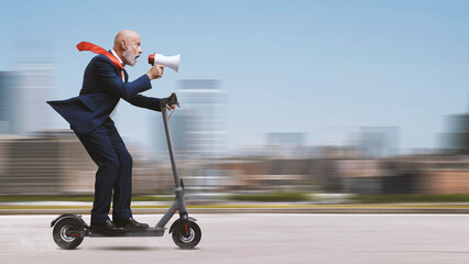 Businessman riding an electric scooter and shouting through a megaphone