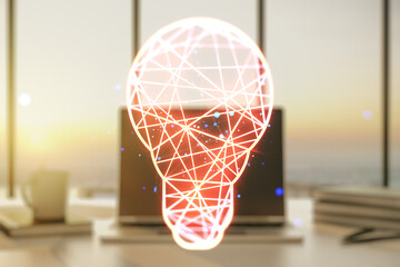 Creative idea concept with light bulb illustration on modern laptop background. Multiexposure