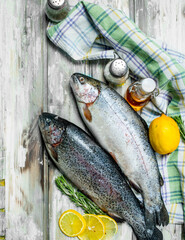 Raw fish salmon with herbs and lemon.