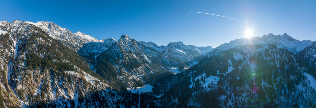 Majestic snowy mountain range on sunny day
