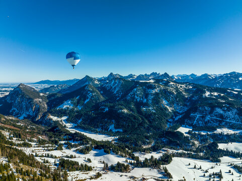 Germany, Bavaria, Oberjoch, Hot air balloon flying over Allgau Alps