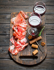 Spanish ham with a glass of red wine.