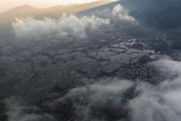 Aerial view of rice terraces at sunrise with clouds