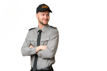 Young security caucasian man over isolated background with arms crossed and happy
