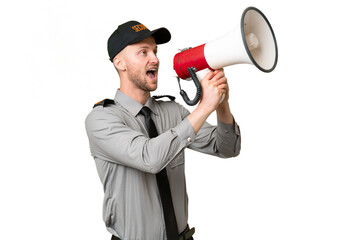Young security caucasian man over isolated background shouting through a megaphone