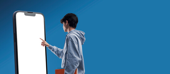 Student interacting with a touch screen smartphone