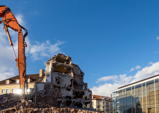 Germany, Bavaria, Munich, Construction vehicle demolishing building