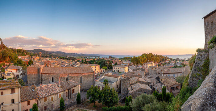 Italy, Lazio, Bolsena, Panoramic view of town at dusk