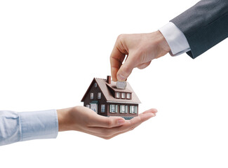Man putting a coin in a model house