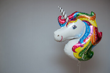 white unicorn foil balloon with helium © Анастасія Жукова
