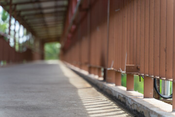 Fototapeta na wymiar a shadow of a railing. Empty walkway in the center.
