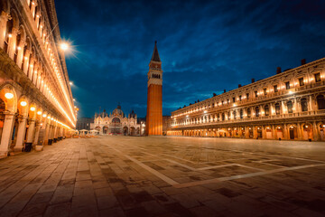 St. Mark's Square (Piazza San Marco) of Venice without people and illuminated historic buildings