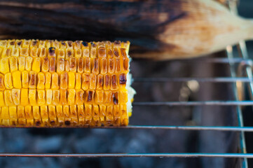 Charcoal-grilled corn using charcoal made from rubber wood