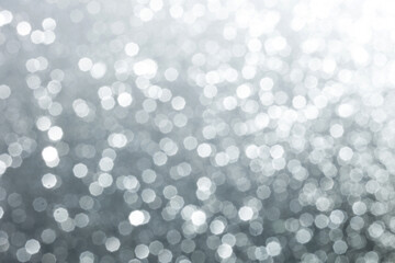 Silver glittering background for design and free space.
