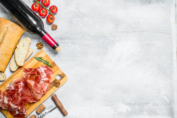 Traditional Spanish ham with ciabatta and red wine.