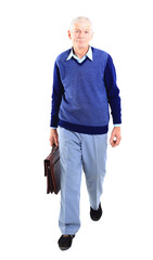 Full length of a happy senior man standing confidently on white background.