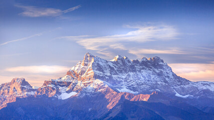 Sinrise or sunset panoramic banner view of the Dents du Midi in the Swiss Alps, canton Vaud, Switzerland