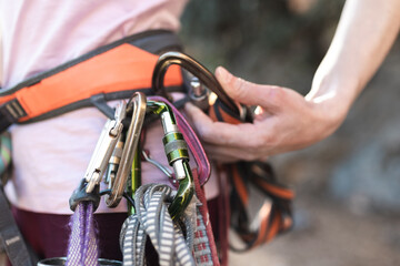 Carabiners and quickdraws on the climber's harness