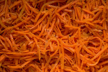 Fototapeta premium Close-up of Korean carrot salad with hot spices. View from above