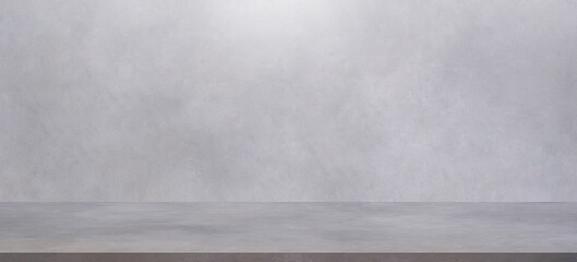 Background of empty gray cement wall room studio with concrete floor in panoramic view for well...