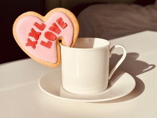 cup of coffee with heart shaped cookies