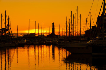 GENOA, ITALY, NOVEMBER 20, 2022 - View of Lanterna (Lighthouse) of Genoa at sunset, Italy.