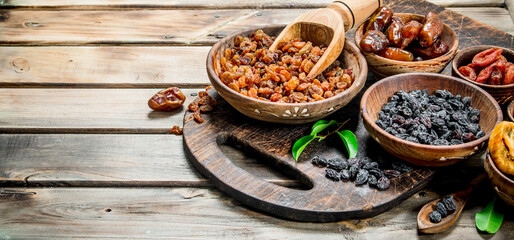 Assortment of different dried fruits in bowls.