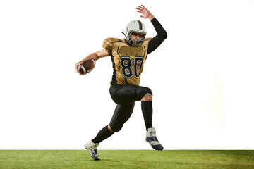 Man, professional american football player in motion, training over white studio background. Motivated sportsman. Concept of sport, competition