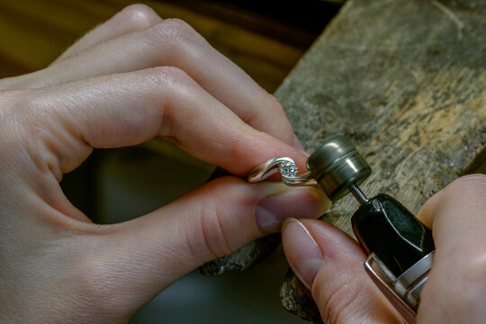 Profession jeweler. Hands of an jeweller . Craft jewelry making. Handwork . Close up
