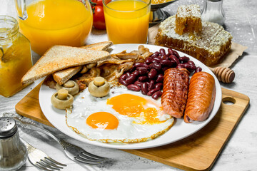 English breakfast. A variety of snacks with orange juice.