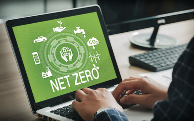 Businessman using computer to analyze strategy. Net zero. Zero emissions concept by 2050. Long term...