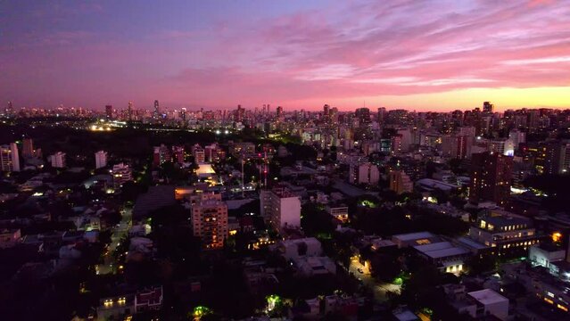 Aerial view establishing the N&uacute;&ntilde;ez neighborhood, wealthy neighborhood of the Argentine capital, epic sunset with clouds.