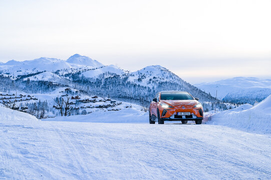Rauland, Norway - January 14, 2023: Orange electric car MG4 is a hatchback chinese electric car