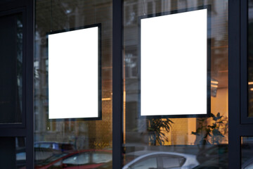 Blank window poster template. Promotional banner on the store, office window mock up. Blurred...
