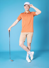 Image of young Asian man golfer on blue background