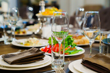 a festive served table with snacks and tableware.