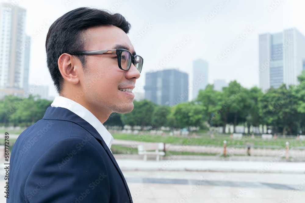 Wall mural photo of asian businessman outdoors