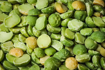 Dried green split peas (Pisum sativum) top view macro detail backdrop close-up uncooked raw