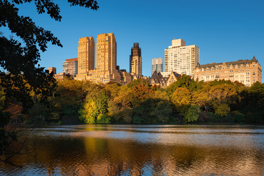Central Park Lake at sunrise with view of Upper West Side buildings. Manhattan, New York City
