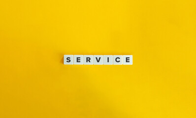 Service Word on Block Letter Tiles on Yellow Background. Minimal Aesthetics.