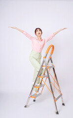 Image of young Asian woman clamb up to the ladder © Timeimage