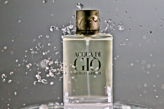 ACQUA DI GIO by Giorgio Armani, perfume bottle with water splash on gray background