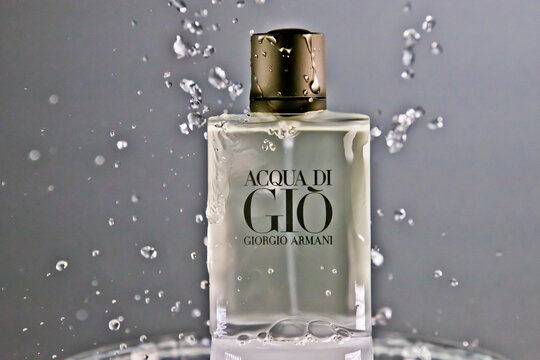 ACQUA DI GIO by Giorgio Armani, perfume bottle with water splash on gray background